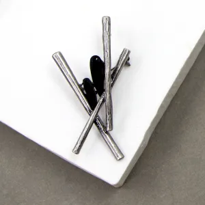 Contemporary criss cross brooch with jet crystal